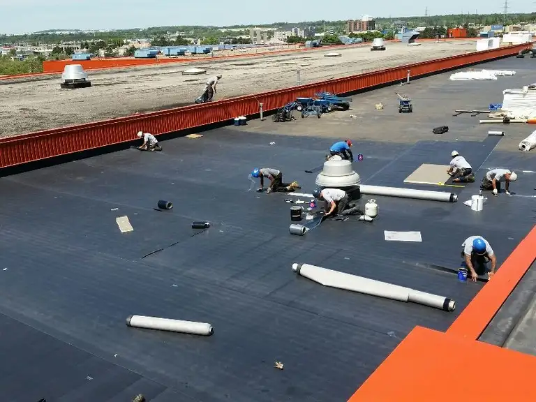 Sinclair crew installing a new commercial roof